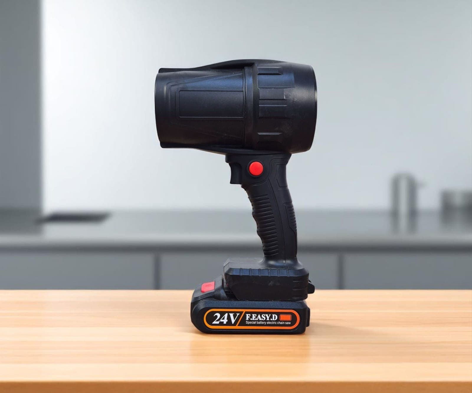 A portable power station on a wooden floor in a dimly lit room.